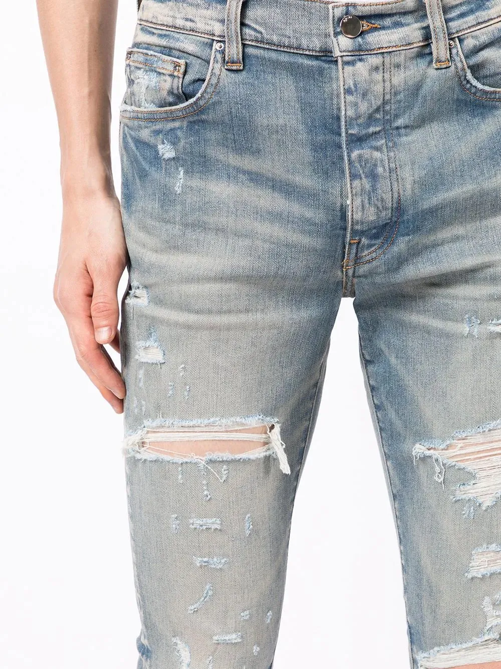 AMIRI DISTRESSED SKINNY JEANS