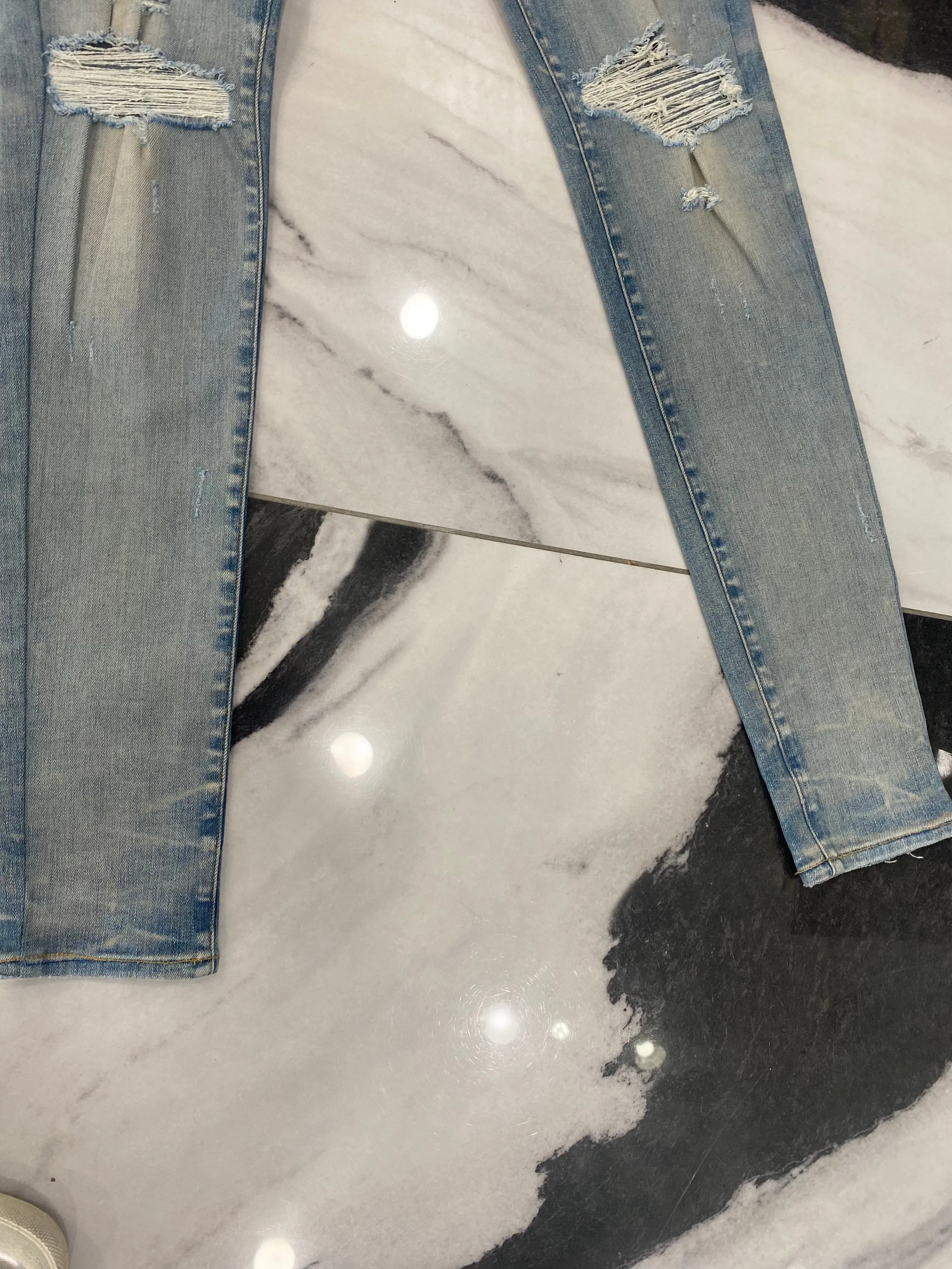 AMIRI DISTRESSED SKINNY JEANS