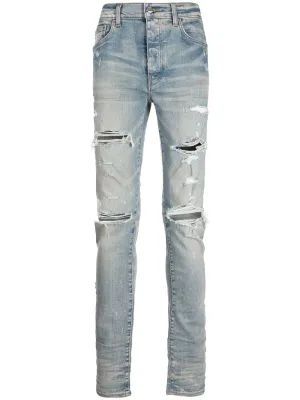 AMIRI DISTRESSED SKINNY JEANS